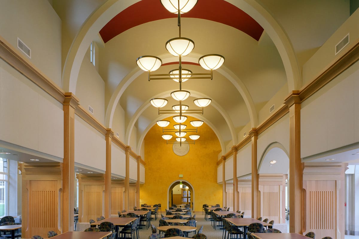 Tables and chairs in room with arched ceilings